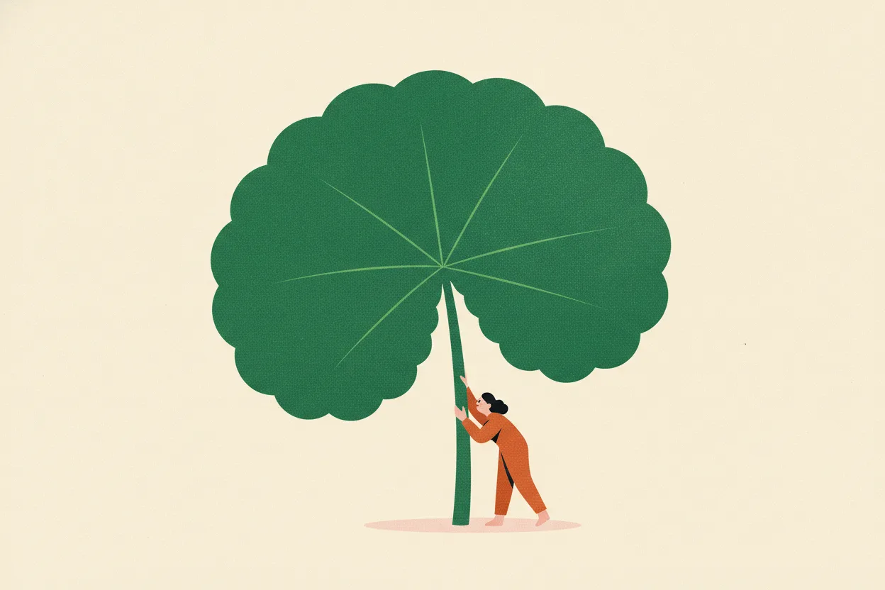 Illustration of a huge round scalloped jade-green leaf like a shield with a tiny rust-orange figure standing beside its stem on cream